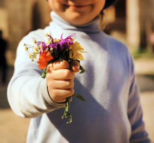 child with flowers