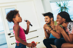 family singing karaoke