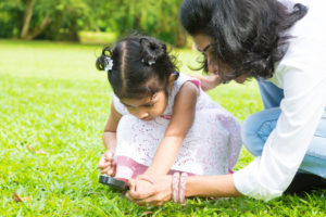 Mother and daughter exploring nature