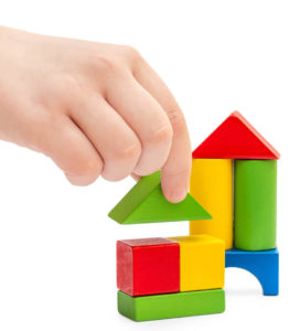 child stacking blocks