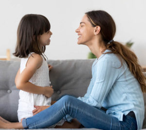 Mom and daughter laughing together