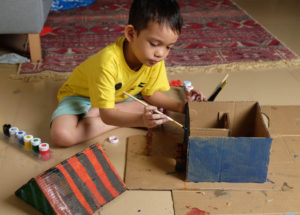 boy making a do-nothing-machine