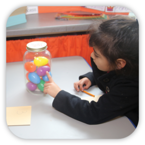 Girl looking at eggs in a jar