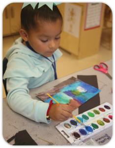 child painting with watercolors