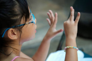 girl counting with her fingers