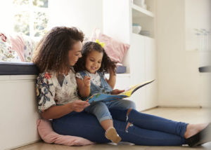 Mother and daughter reading a book