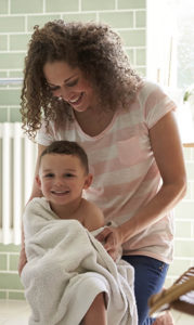 Mother Drying Son With Towel After Bath