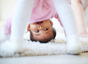 little girl somersaulting