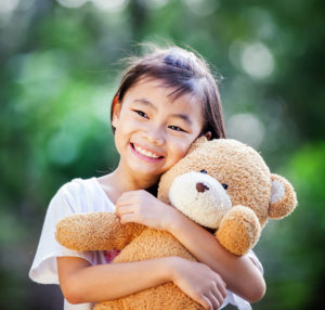 Girl with teddy bear